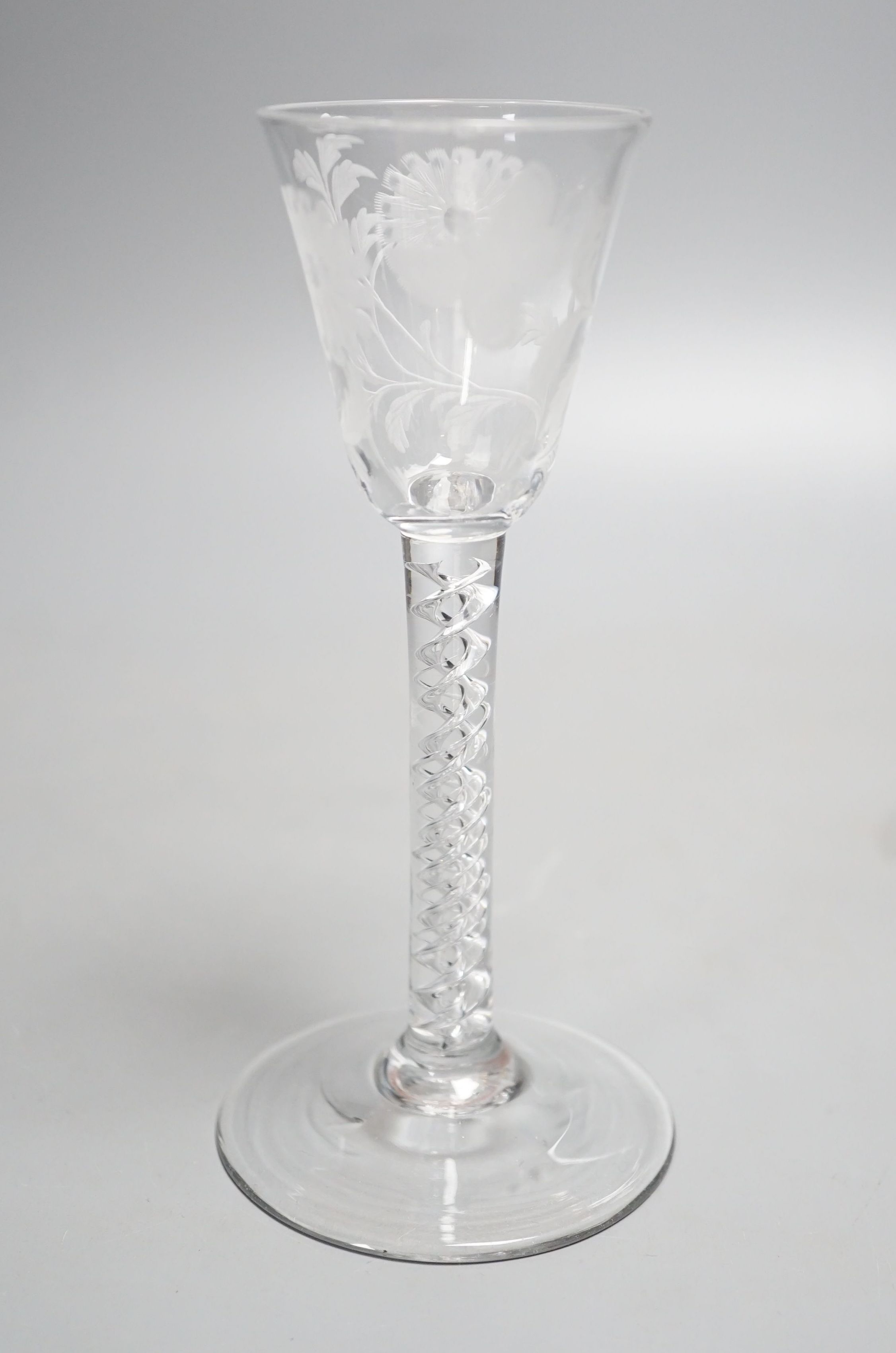 A Georgian air twist stem cordial glass, possibly later engraved with flowers and a butterfly, possibly of Jacobite significance. 16cm